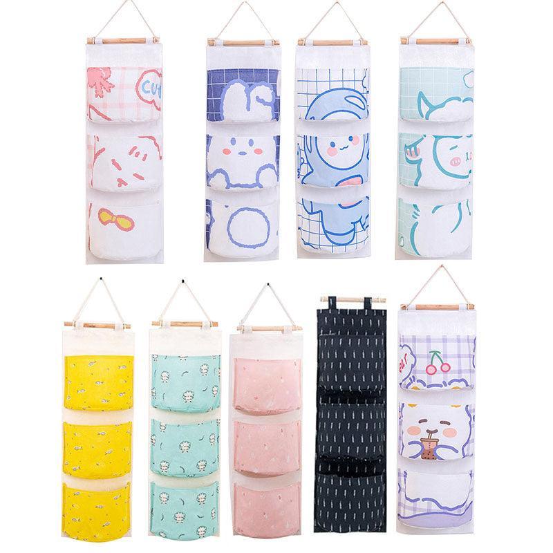 3 Pocket Hanging Storage Bag with Wooden Rod for Wall or Door Organisation - Astronaut